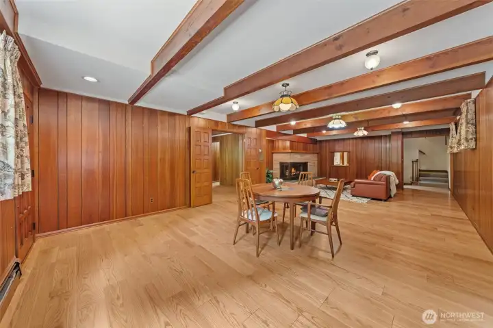 This spacious family room offers endless flexibility for entertaining, recreation, or multi-generational living with room for a lounge area, game table, and more.