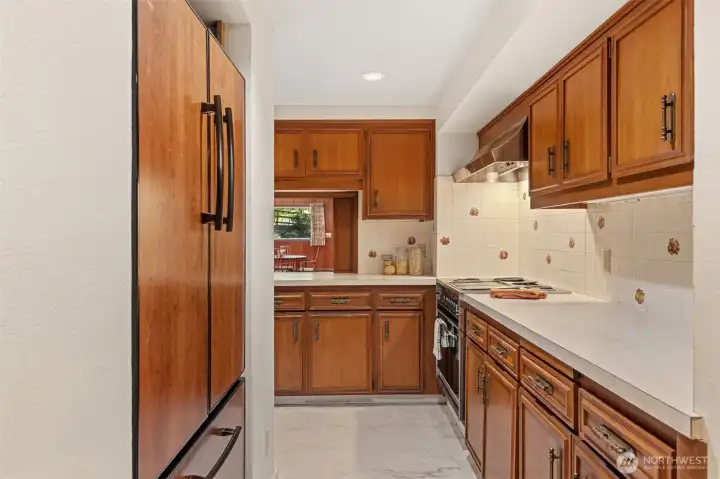 The lower-level kitchen maximizes efficiency with ample cabinetry, long stretches of counter space, and an organized workflow. Whether used for multigenerational living, hosting overnight guests, or creating a separate living suite, this fully functional kitchen adds exceptional flexibility to the home.