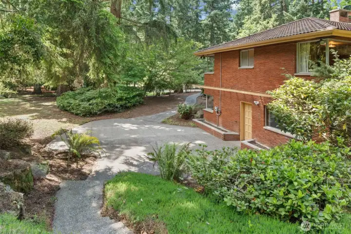 This private patio extends off of the lower level, creating a separate outdoor space from the main level patio. This design is ideal allows for private outdoor entertaining simultaneously, whether down here or up off the dining room. Multiple exterior access points make it easy to enjoy the backyard and indoor-outdoor living.