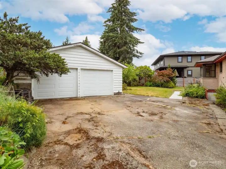 Huge detached 2 car garage with area for shop.