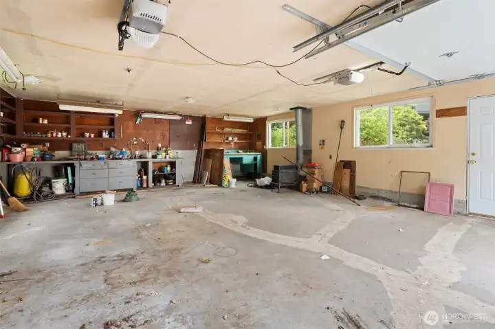 Huge detached 2 car garage with area for shop.