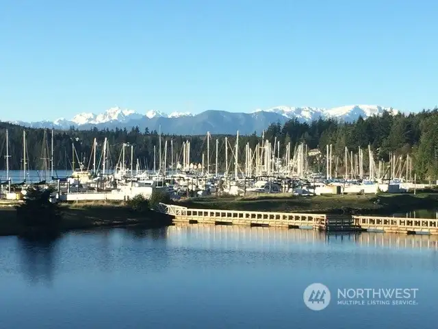 The majestic Olympic Mountains tower over Port Ludlow Bay and marina.