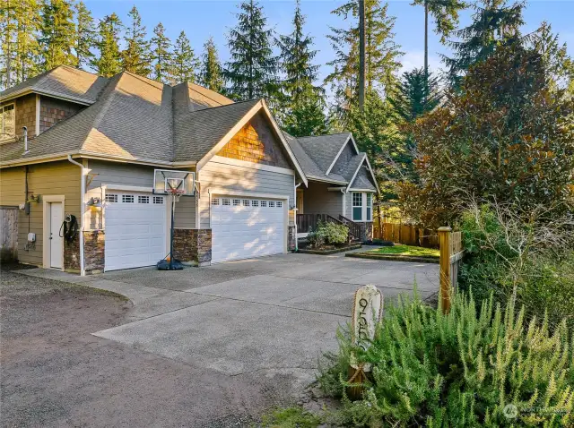 Welcome to 9555 NE Lovgreen. This charming craftsman home offers 3 main floor bedrooms, a private guest suite on the second level, and a sweeping sunny back yard.