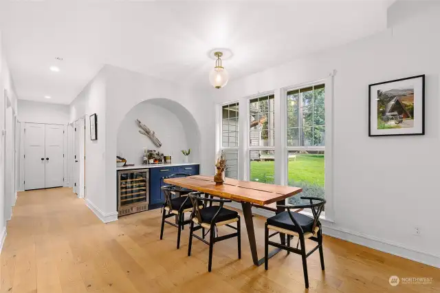 Large windows frame the backyard, letting sunlight flow in, and giving clear sightlines for outdoor play.