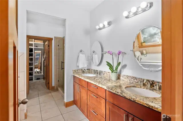 Primary bath is spa-like, with a large walk-in closet with built in storage