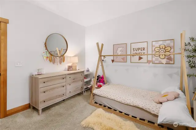 The secondary bedroom wing features 2 more bedrooms, a large bathroom, and an oversized laundry/mudroom.