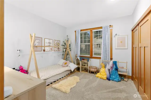 Bedroom 2 with an oversized closet and beautiful wood trim.