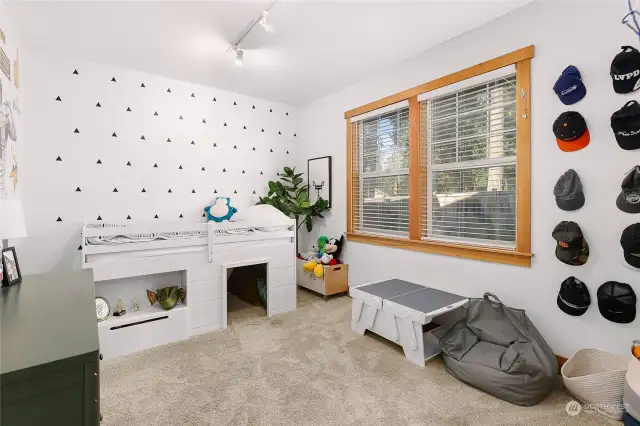 Bedroom 3 features a walk in closet. Tall ceilings make each room feel even more expansive.