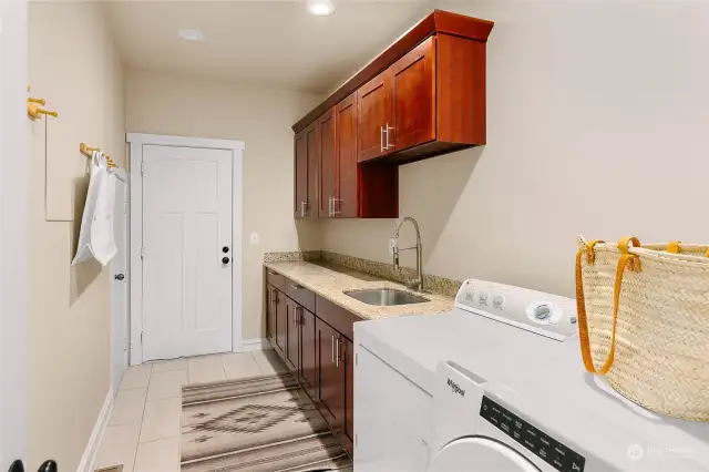 Located off the 3 car garage, the large laundy/mudroom space is centrally located, and incredibly functional!