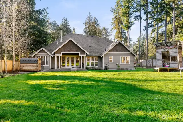 The yard is fully fenced and landscaped, complete with lighting and irrigation.