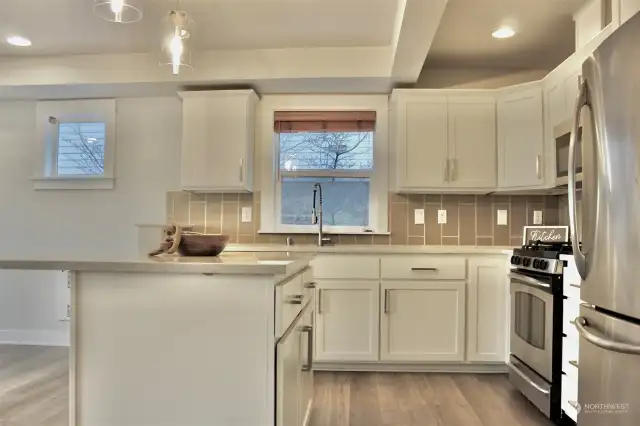 view of kitchen from bathroom door