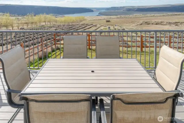 Quaint back deck with surrounding views.