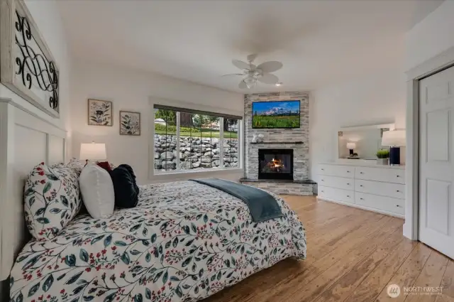 Guest suite off the entry with walk-in closet, gas fireplace and 3/4 bath. Mounted TV conveys.
