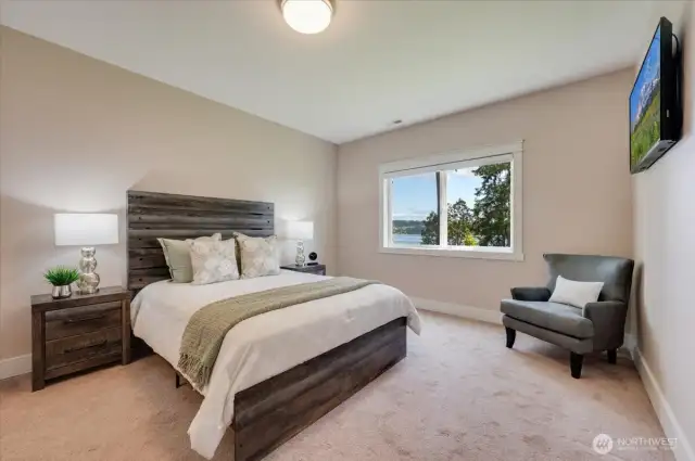 LL guest suite includes walk-in closet and full bath. Mounted TV conveys.