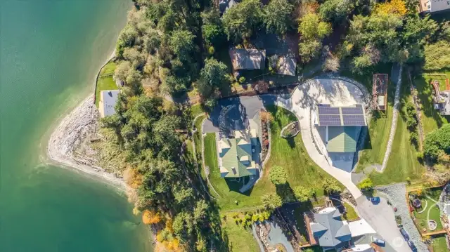 View of the home, shop, waterfront & grounds from above