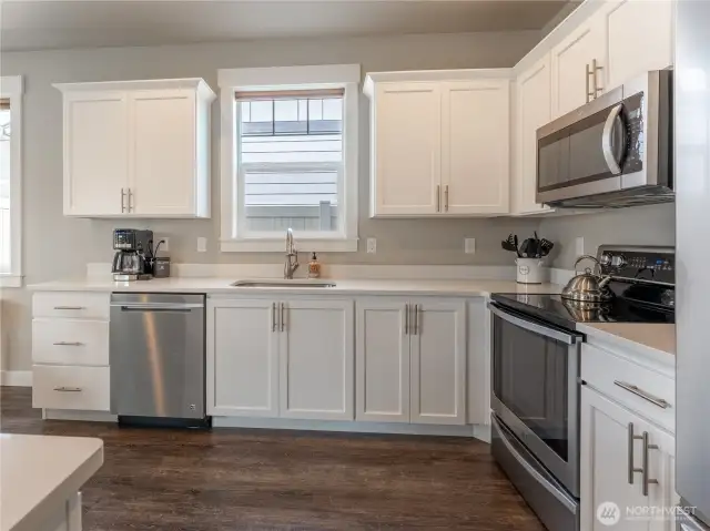 White cabinetry and quartz counters