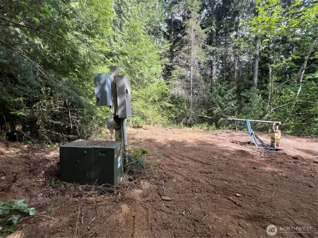 This DOT well/power is located on the lower section of lot 8 - The upper loop of Lot 8 is the more ideal build location with more level, usable space.