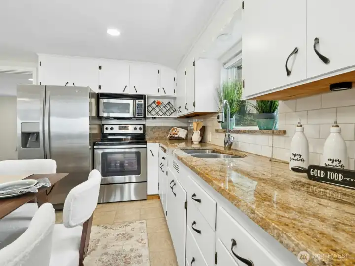 Beautiful Granite Countertops, Whirlpool Refrigerator, Microwave, Electric Stove, Kitchenaid Dishwasher