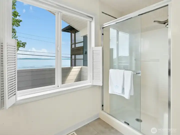 Main Bathroom window faces the Puget Sound. Cafe/Beach Styled Window Shutters for privacy incase someone is on the 2F Balcony