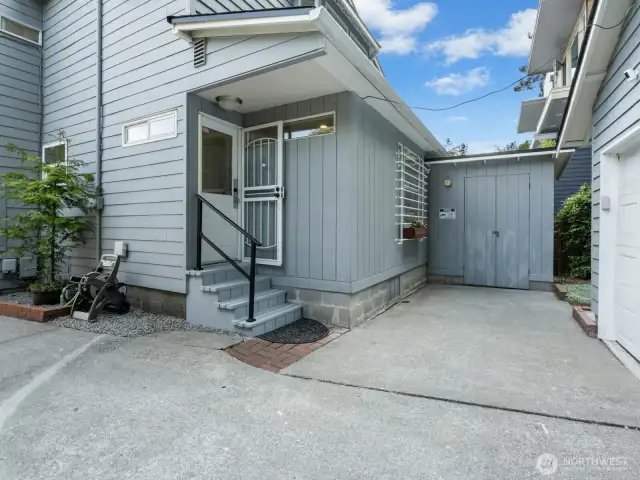 Rear entrance to the home leading to the  detatched garage.