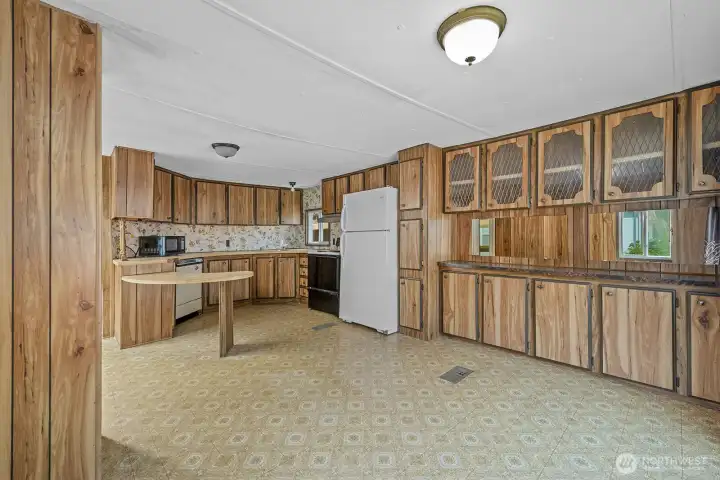 Dining area with ample built-in storage and convenient access to the kitchen.
