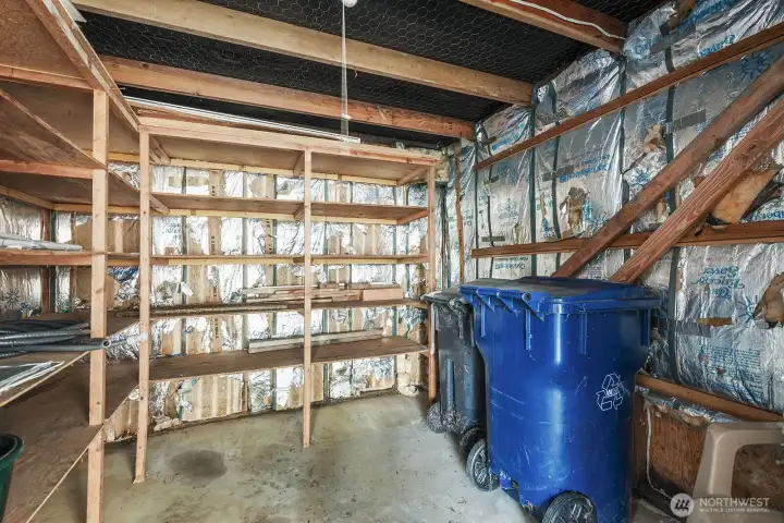 Enclosed storage area with sturdy shelving- ideal for tools, bins, and seasonal items.