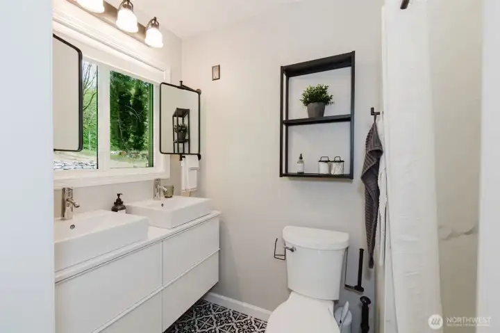 Newly updated bathroom with large walk-in shower.