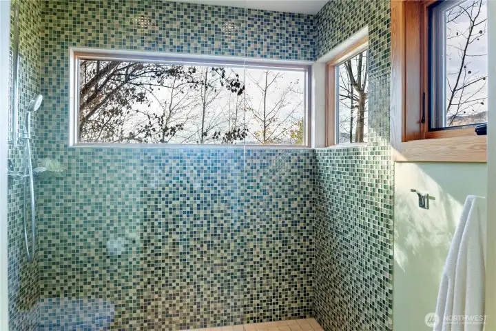 Each bathroom is fitted with custom tilework -- and some have exterior views too!
