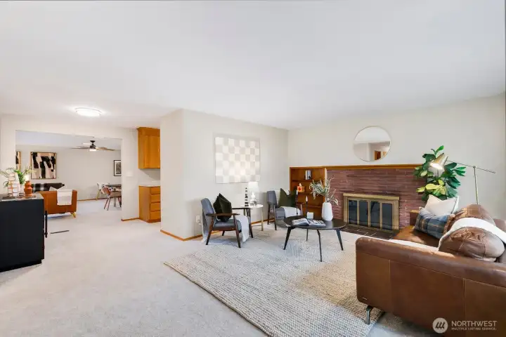 Step into the cozy formal living room with a charming wood-burning fireplace, perfect for relaxing evenings.