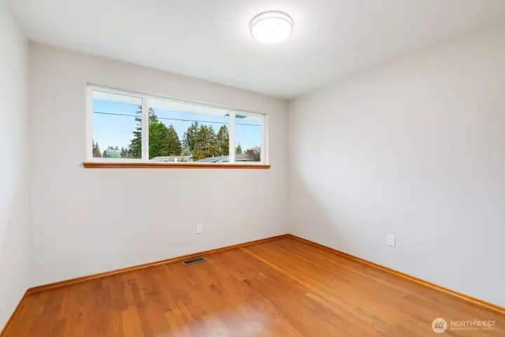 Bedroom 3. Original hardwoods also under carpet in hall & formal living room.