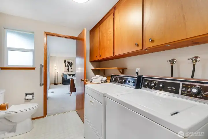 Large laundry room with half bath adds convenience to your daily routine.