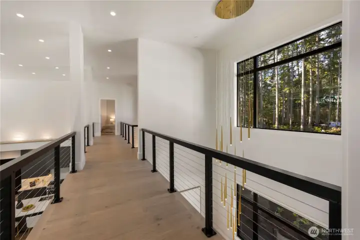 Upstairs walkway and 15 ft custom dining table Mod light fixture