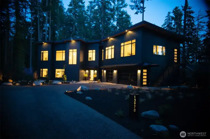 Evening exterior, lighted address sign