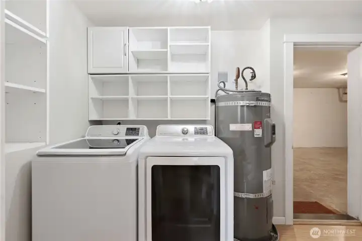 Washer/dryer and entryway to the attached 1 car garage