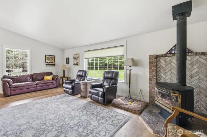 View of the living area from the hall that leads to the bedrooms.  Large privacy window that still allows the nature lights in