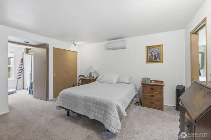 Primary bedroom with the bathroom on the right