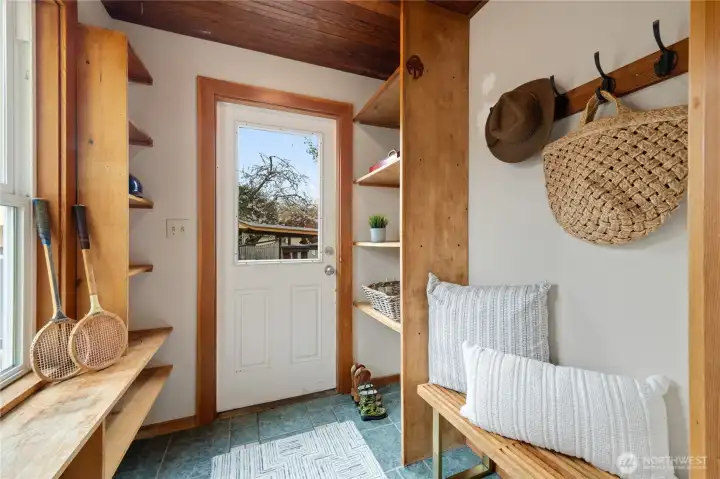 mud room off of the kitchen leads to the back deck