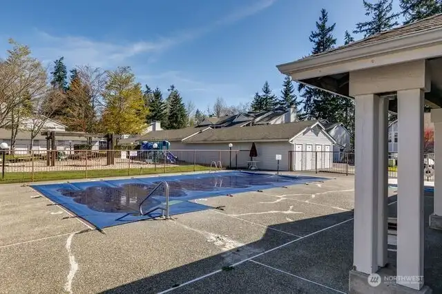 outdoor pool and playground area