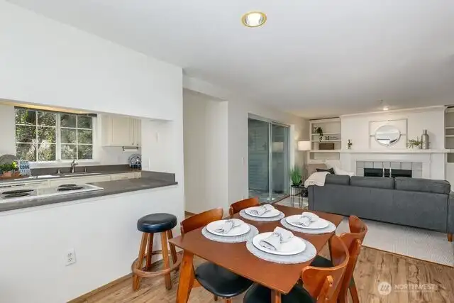 Another view of the space between the kitchen, dining room, and living room