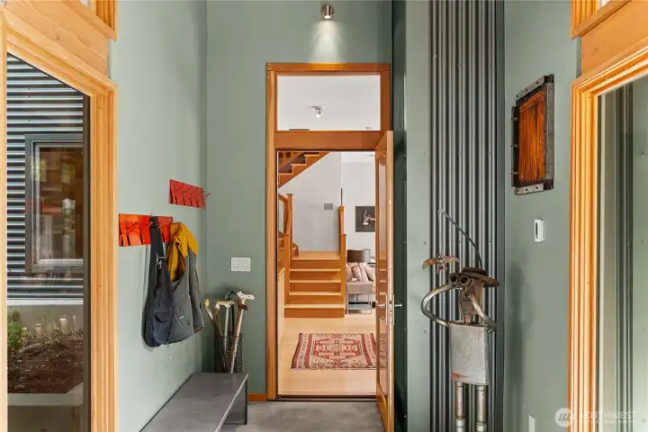 The mudroom has lots of room for coats and boots, and leads to the warm wood interior.