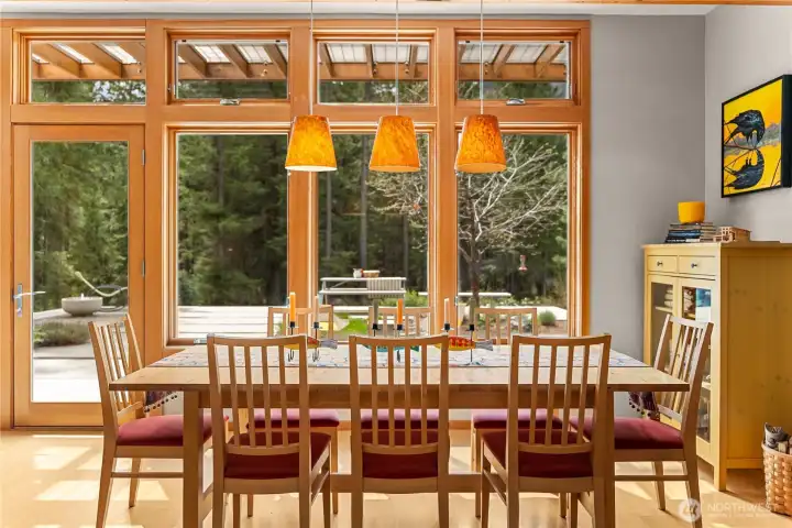 Large enough for a crowd, the dining room looks out to the sunny terrace.