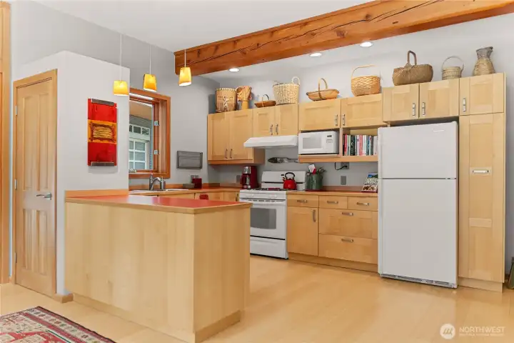 The open kitchen and serving counter is well set up for entertaining, with lots of storage.