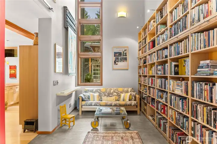 The stunning library has heated concrete floors and windows that stretch high into the double-height space.