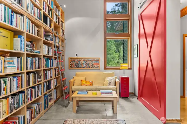 With room for overnight guests, the library can be closed for quiet or privacy with a dramatic sliding barn door.
