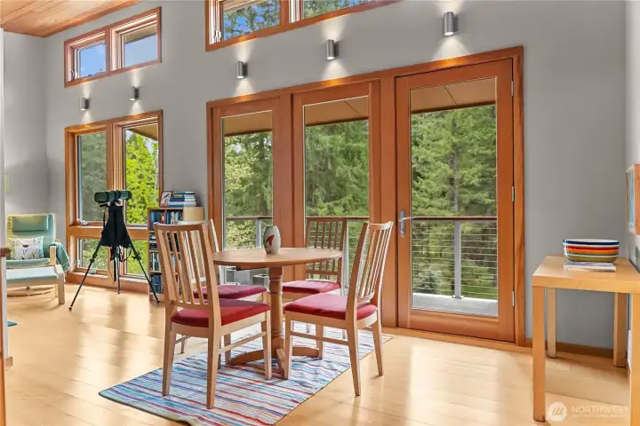 The primary suite on the second floor includes a large open sitting area with access to its private deck.