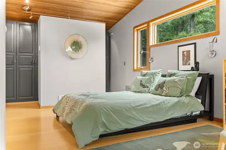 The primary bedroom is roomy and bathed in natural light.