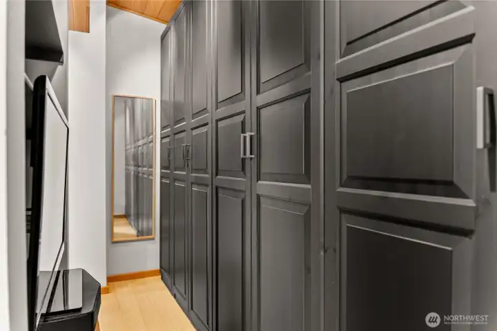 The primary bedroom has a separate changing area and a long run of closets.