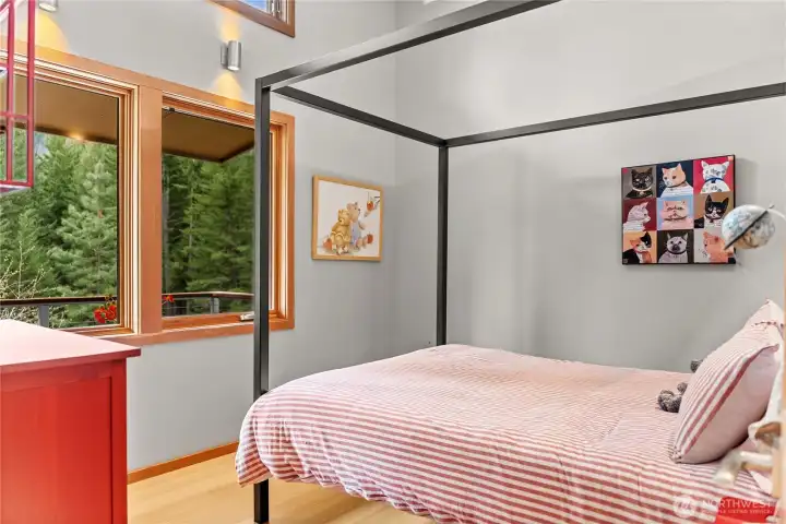 A third bedroom connects to the primary suite, and could double as a private office.
