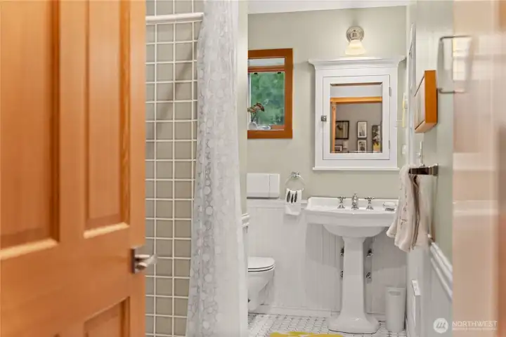 The downstairs bath is roomy and has a large walk-in shower.