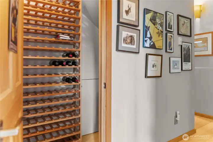 A closet has ben nicely retrofitted for your wine collection.